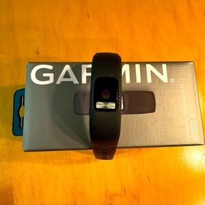 Garmin Vivofit 4 - never worn but has been opened and the watch is on.